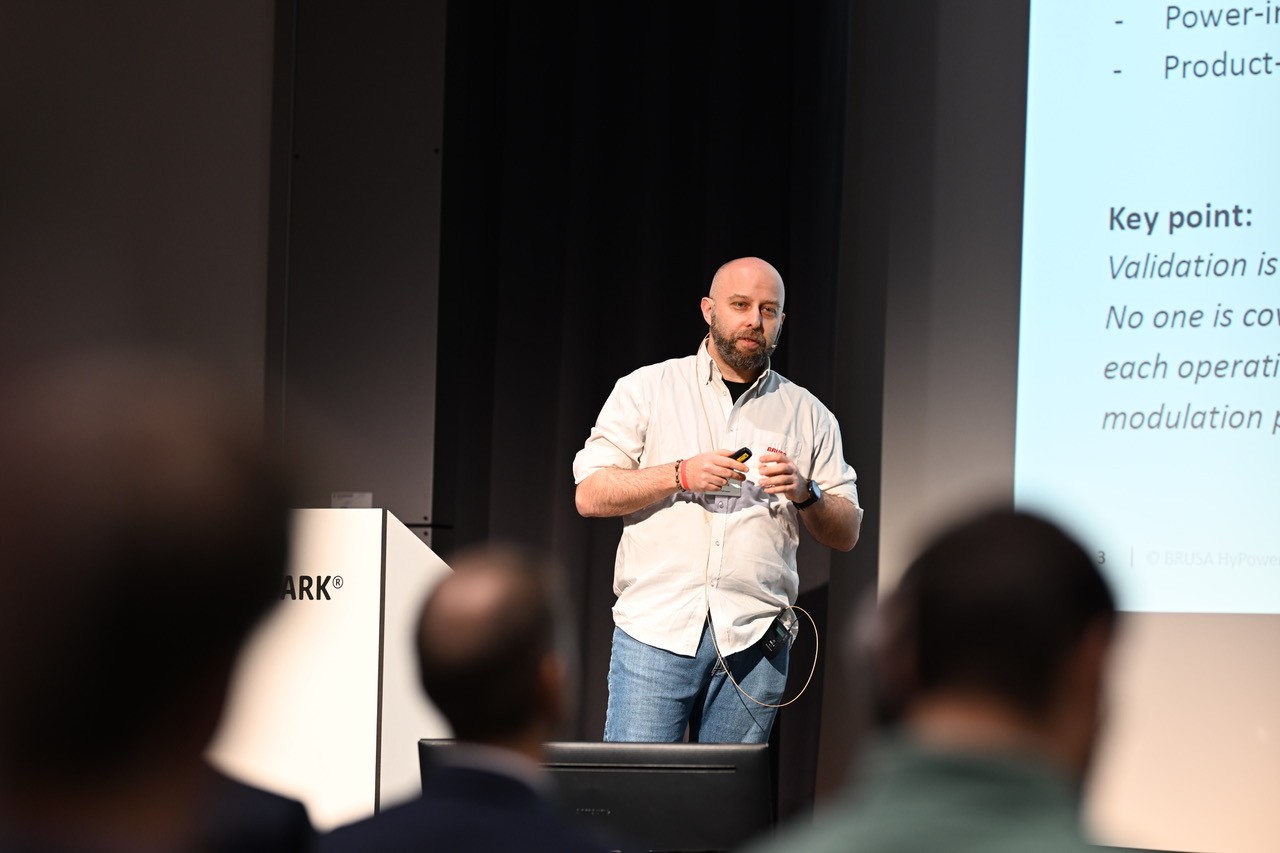 Riccardo Tinivella discussing validation during a conference presentation
